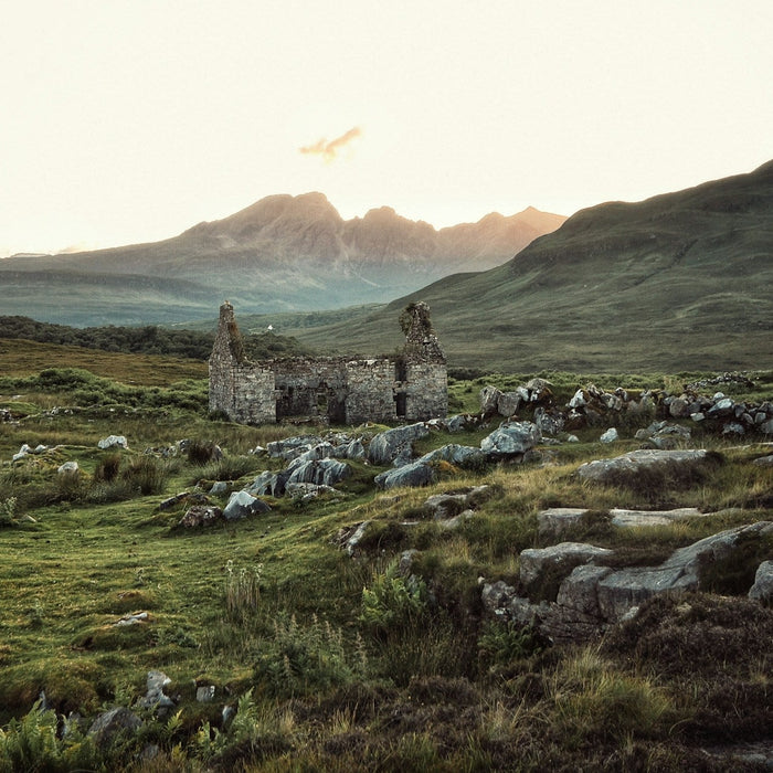 Scottish peatland landscape at dusk, illustrating the natural origin of peat used in peated whisky production