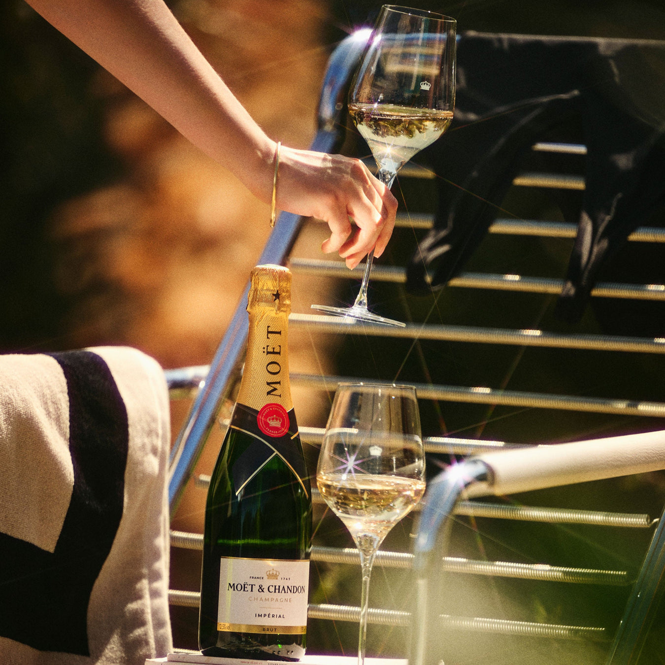 A moet bottle and two glasses of champagne - Kent Street Cellars