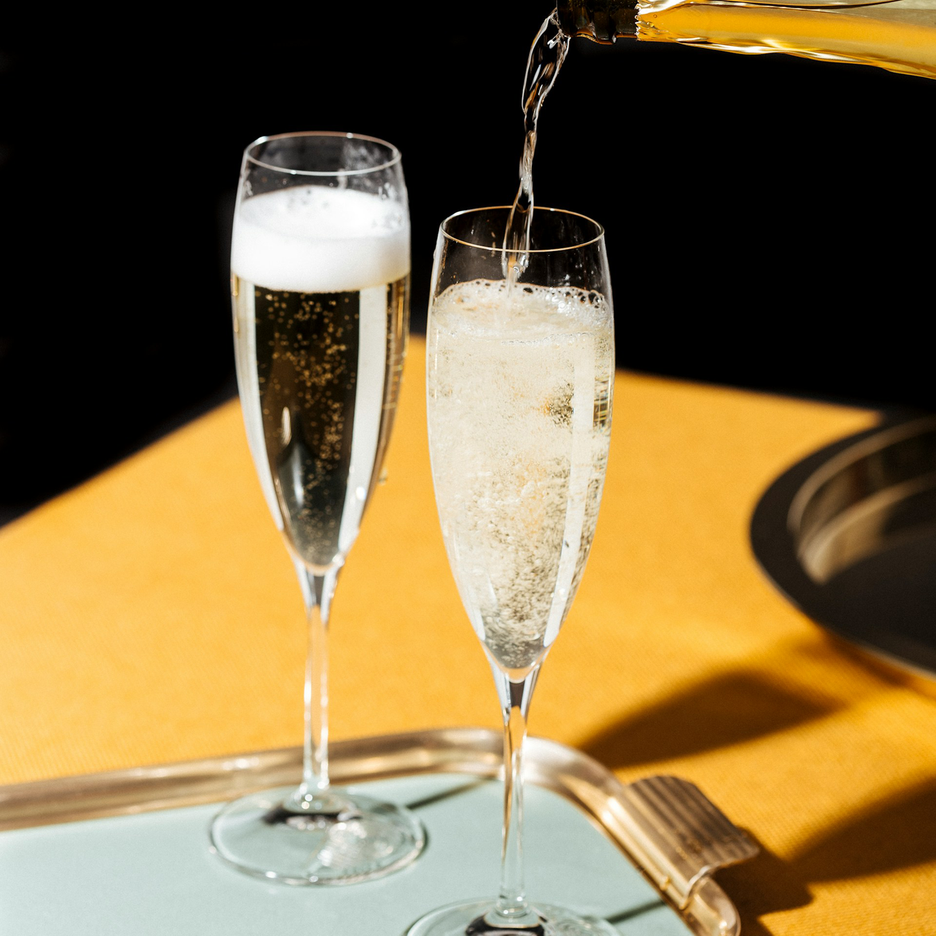 Prosecco being poured into glasses - Kent Street Cellars